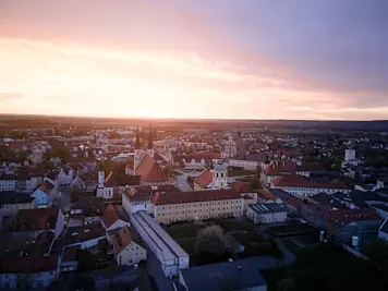 Drone photography of a square in Altotting during Osterforum 2025 took during Sunset.