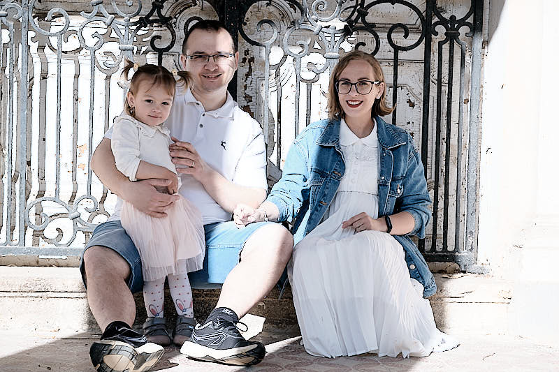Family photoshoot waiting for twins